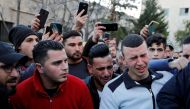 Relatives of 17-year-old Palestinian Mohammed Al-Hadad react at a hospital in Hebron in the Israeli-occupied West Bank February 5, 2020. Reuters/Mussa Qawasma
 