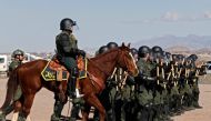 US Border Patrol agents conduct a training exercise in the Anapra area, in front of the wall that divides Sunland Park, New Mexico, US, from Mexico, as seen from Ciudad Juarez, Chihuahua state, on January 31, 2020. AFP / Herika Martinez 
 
