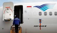 A technician prepares to check Boeing 737 Max 8 airplane of Garuda Indonesia parked at the Garuda Maintenance Facility AeroAsia at Soekarno-Hatta International airport, March 13, 2019. Reuters / Willy Kurniawan
