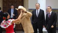 Russia's Foreign Minister Sergey Lavrov and his Venezuelan counterpart Jorge Arreaza watch couples dance to folkloric music as they arrive for a meeting in Caracas, Venezuela February 7, 2020. Reuters/Fausto Torrealba