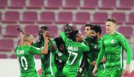 Al Ahli players celebrate after defeating Qatar SC in their Amir Cup pre-quarter-final match played at the Grand Hamad Stadium in Doha, yesterday. Al Ahli won 2-1.