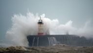 Waves crash over Newhaven Lighthouse on the south coast of England on February 9, 2020, as Storm Ciara swept over the country / AFP / GLYN KIRK