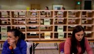 Staff members count votes in Ireland's national election, in Cork, Ireland, February 9, 2020. Reuters/Henry Nicholls
 