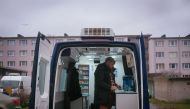 Jaan Vaart, former drug user and nowadays coordinator of the harm reduction service, poses for a picture inside a van equipped with syringes and emergency equipment that he uses in his daily job, in Tallinn on November 18, 2019. AFP / Alessandro Rampazzo
