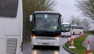 A convoy of coaches carrying British nationals evacuated from Wuhan in China amid the novel coronavirus outbreak, arrives at Kents Hill Park conference centre and hotel in Milton Keynes, north of London on February 9, 2020, where they will be kept in isol