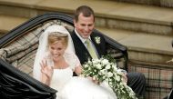 Britain's Peter Phillips (R) and Canada's Autumn Kelly leave St George's Chapel after their marriage in Windsor, southern England on May 17, 2008. REUTERS/Sang Tan/Pool/File Photo