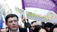 Gigi Ugulava marches with supporters of the opposition United National Movement along a street in Tbilisi on December 28, 2013, shortly after being suspended as mayor of the Georgian capital. Reuters/David Mdzinarishvili