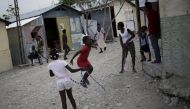 Girls play at a camp for displaced people in Port-au-Prince, Haiti, March 6, 2016. Reuters / Andres Martinez Casares