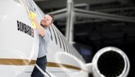 Bombardier employee Francis Masse polishes the sign of Bombardier Global 7500 shown during a media tour in Montreal, December 19, 2018. Reuters / Christinne Muschi