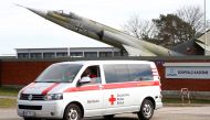 A van of Germany's Red Cross leaves the 