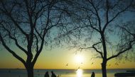 People walk along a park during the sunset in Istanbul, Turkey, February 17, 2019. Reuters/Umit Bektas