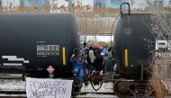 Supporters of the indigenous Wet'suwet'en Nation occupy railway tracks as part of a protest against British Columbia's Coastal GasLink pipeline, in Toronto, Ontario, Canada February 15, 2020. Reuters/Chris Helgren 