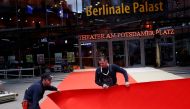Workers lay the red carpet for the upcoming Berlinale Film Festival in Berlin, Germany February 18, 2020. Reuters/Michele Tantussi