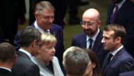 German Chancellor Angela Merkel, Romanian President Klaus Iohannis, European Council President Charles Michel and France's President Emmanuel Macron attend the second day of the European Union leaders summit, held to discuss the EU's long-term budget for 