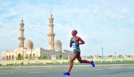 Kenya’s Pius Karanja on his way to win the 2020 Al Mouj Muscat Marathon, yesterday.