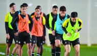 Al Sadd's players in action during a practice session.