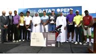 Michael Young of Ireland, winner of the Qatar Open Amateur Golf Championship, poses for a picture with other podium winners and officials of Qatar Golf Association at Doha Golf Club yesterday. Pictures: Syed Omar