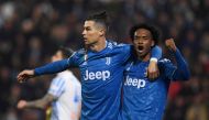 Juventus' Cristiano Ronaldo celebrates scoring their first goal with Juan Cuadrado REUTERS/Alberto Lingria