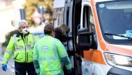 A woman is taken into an ambulance amid a coronavirus outbreak in northern Italy, in Casalpusterlengo, February 22, 2020. REUTERS/Flavio Lo Scalzo