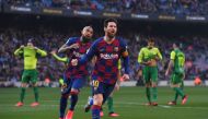 Barcelona's Argentine forward Lionel Messi (R) celebrates after scoring during the Spanish league football match FC Barcelona against SD Eibar at the Camp Nou stadium in Barcelona on February 22, 2020. / AFP / Josep LAGO