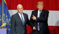Donald Trump and Mike Pence wave to the crowd before addressing the crowd during a campaign stop at the Grand Park Events Center in Westfield, Indiana, July 12, 2016. Reuters