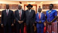 South Sudanes President Salva Kiir (3rd-L) shakes hands with First Vice President Dr Riek Machar (2nd-L) as Third Vice President Taban Deng Gai (L), Second Vice President James Wani Igga (2nd-R) and Fourth Vice President Rebecca Garang attend their sweari
