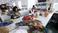 Artists work on a carnival mask at the Venice Art Mask workshop in Shkoder, Albania, on February 20, 2020. AFP / Gent Shkullaku 