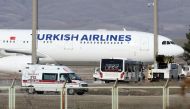 :An ambulance drives past by a Turkish Airlines (THY) plane from Tehran after landing at Esenboga International Airport in Ankara, Turkey, February 25, 2020. REUTERS/Stringer NO RESALES. NO ARCHIVES
