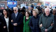 Tulsi Gabbard, Joe Biden, Amy Klobuchar, Elizabeth Warren and Bernie Sanders, walk arm-in-arm with during the MLK Day Parade in Columbia, January 20, 2020. Reuters / Randall Hill