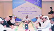 Sheikh Jassim bin Hamad bin Jassim bin Jaber Al Thani (centre), Chairman of Beema; Abdulatif Abdullah Al Mahmoud, Deputy-Chairman, and other Board members, during the Annual General Assembly Meeting of Beema held at Grand Hyatt Hotel, yesterday. Pic: Bahe