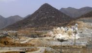 File photo: A cloud of dust rises from a dynamite blast as part of construction work at Grand Renaissance Dam, Ethiopia, March 31, 2015. Reuters / Tiksa Negeri