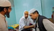 Mohammad Zubair, 37, who is Muslim and was injured after being beaten by a group of men chanting pro-Hindu slogans during protests sparked by a new citizenship law, sits inside his relative's house in New Delhi, India, February 26, 2020.  Reuters/Danish S