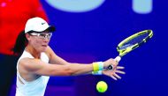 China's Saisai Zheng returns the ball to Kiki Bertens of The Netherlands at the Khalifa International Tennis Complex, yesterday.