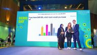 Hayfa Al Abdulla (left), QSTP Innovation Director, presenting first prize to team ClassTap co-founders Rana Majeed and Bashar Hudhud, at the Demo Day of XLR8 cycle 8.