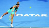 Svetlana Kuznetsova of Russia returns the ball to Belinda Bencic of Switzerland during their quarter-final match of the Qatar Total Open, yesterday.
