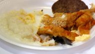 A breakfast plate of grits and fried fish is served to attendees as they listen to Bernie Sanders in St. George, South Carolina, February 28, 2020. Reuters/Jonathan Ernst
 