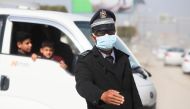 An Iraqi police officer wears a protective face mask following the coronavirus outbreak, as he works in Babylon, Iraq February 27, 2020. REUTERS/Essam al-Sudani