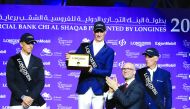 Daniel Deusser (centre) receiving an award after winning the 2020 Commercial Bank CHI Al Shaqab Grand Prix. 
