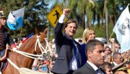 Uruguay's new President Luis Lacalle Pou gestures next to new Vice President Beatriz Argimon as they are driven around the Parliament after being sworn into office, in Montevideo, Uruguay March 1, 2020. Reuters/Andres Cuenca Olaondo