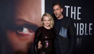 Cast members Elisabeth Moss and Oliver Jackson-Cohen attend the premiere for the film 