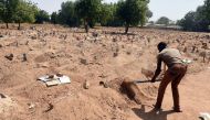 File photo shows a grave-digger at work in Maiduguri