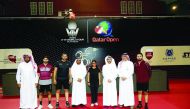 Khaleel Al Muhannadi (fourth left), President of the Qatar and Arab Table Tennis Federations and the Chairman of the Local Organising Committe  for 25th Qatar Open, Ali Sultan Al Muftah, the Tournament Director, Qatari players and officials posing for a p