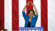 Elizabeth Warren makes the shape of a heart with her hands as she speaks during a campaign rally at Eastern Market in Detroit, Michigan, on March 3, 2020. AFP / Jeff Kowalsky
 
 