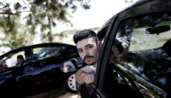 Uber drivers sit in their cars as they wait for passengers in Sao Paulo, Brazil, February 13, 2017. Reuters / Nacho Doce
 
 