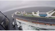 Airmen from the Moffett Federal Airfield based, 129th Rescue Wing deliver coronavirus test-kits to the Grand Princess cruise ship off the coast of California in this still image from a video on March 5, 2020. California National Guard/Handout via Reuters