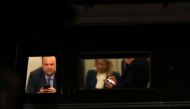 US President Donald Trump, his social media director, Dan Scavino (L), and senior adviser Kellyanne Conway look at their phones together on Marine One on their way back to the White House after returning from Pennsylvania to Joint Base Andrews in Maryland