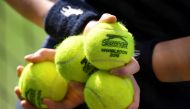 A ball boy holds balls at All England Lawn Tennis and Croquet Club, London in this July 9, 2018 file photo. Reuters / Toby Melville