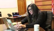 In this picture taken on February 7, 2020, human rights award winner and founder of Pakistan's first cyber-harassment helpline, Nighat Dad, works on her laptop at her office in Lahore. AFP / Amna Yaseen 