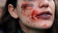 A demonstrator with paint on her face reacts during a protest to mark the International Women's Day in Madrid, Spain March 8, 2020. Reuters/Susana Vera
 
 