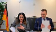 German Health Minister Jens Spahn and Berlin's Health Senator Dilek Kalayci prepare for a meeting with the federal Health Minsters in Berlin on March 4, 2020, to discuss measures in connection with the novel coronavirus. / AFP / Tobias SCHWARZ
